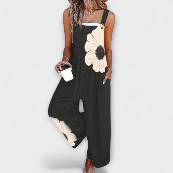 Clémentine - Schwarze Latzhose mit großer Blüte
